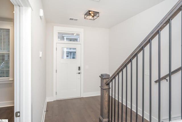 foyer entrance with dark wood-type flooring