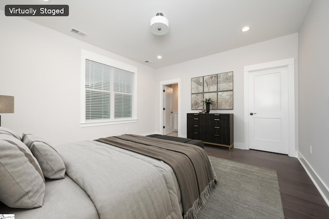 bedroom featuring dark hardwood / wood-style floors