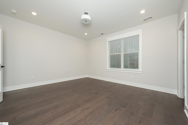 empty room featuring dark hardwood / wood-style floors