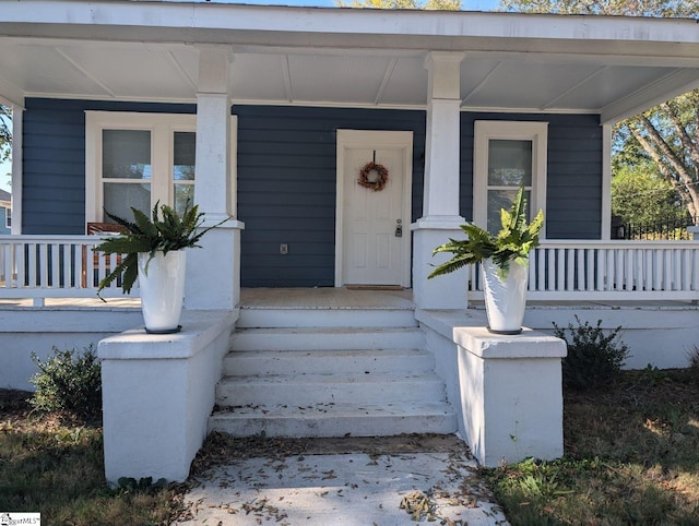 doorway to property with covered porch