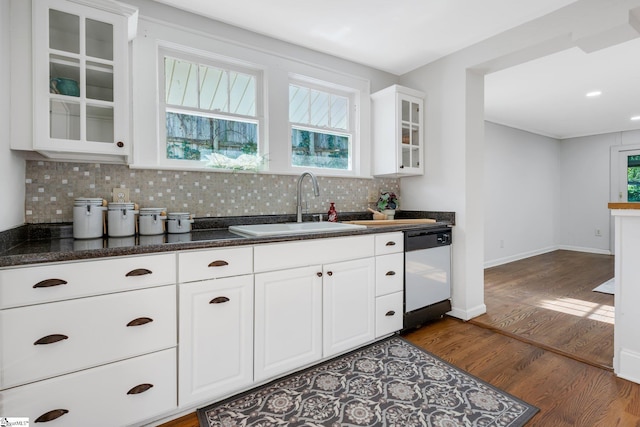 kitchen featuring white dishwasher, white cabinets, sink, and dark wood-type flooring