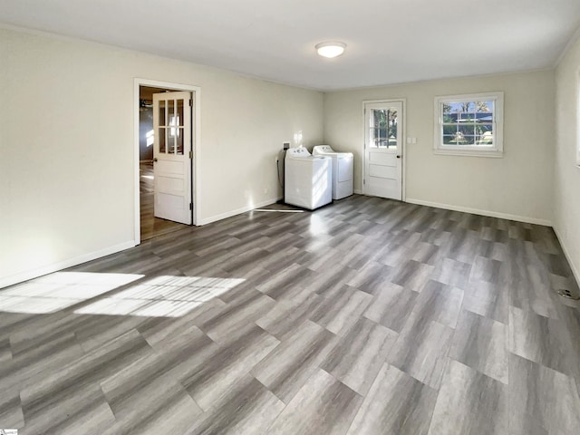 laundry area featuring independent washer and dryer and hardwood / wood-style floors