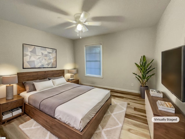 bedroom featuring ceiling fan and light wood-type flooring