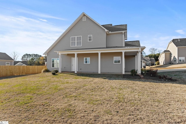 back of house with a yard