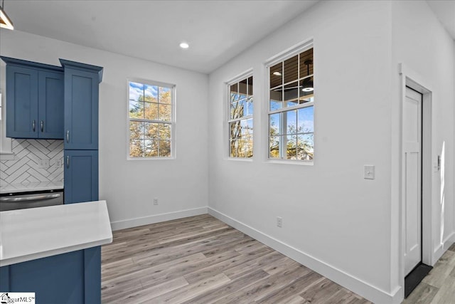 unfurnished dining area with light hardwood / wood-style floors