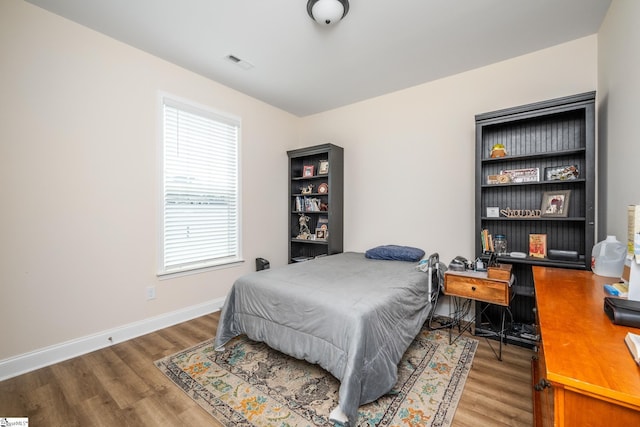 bedroom featuring hardwood / wood-style flooring