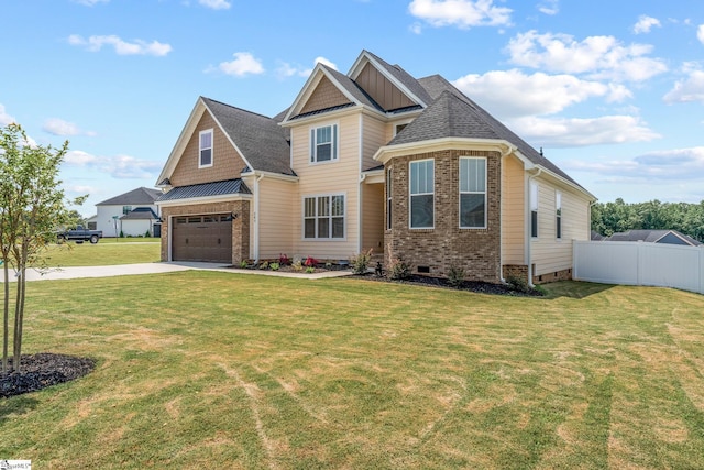 craftsman house featuring a garage and a front yard