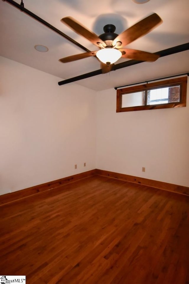 empty room featuring hardwood / wood-style flooring and ceiling fan