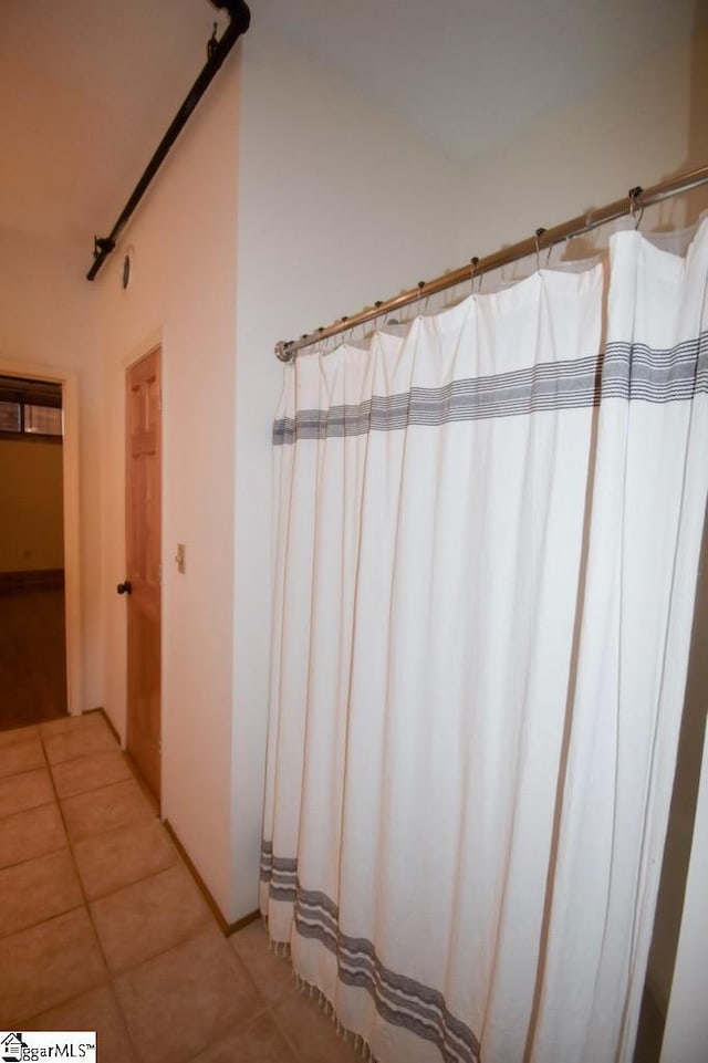 bathroom with tile patterned floors