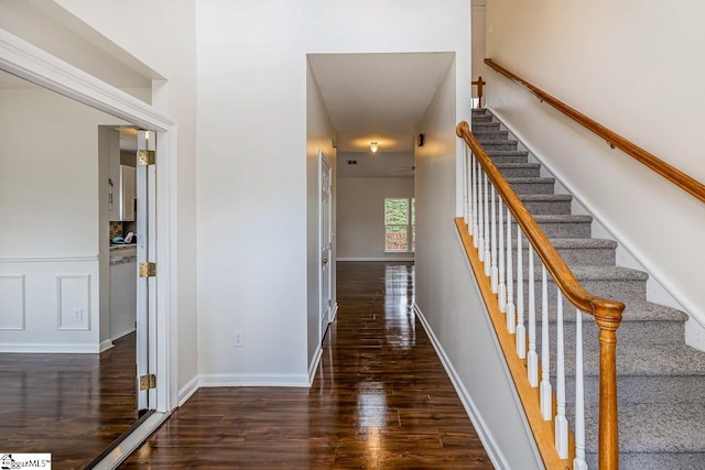 corridor featuring dark wood-type flooring