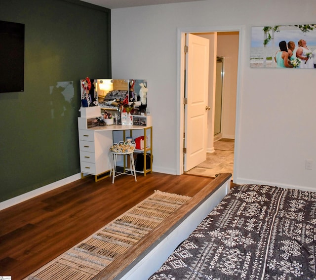 bedroom featuring hardwood / wood-style floors