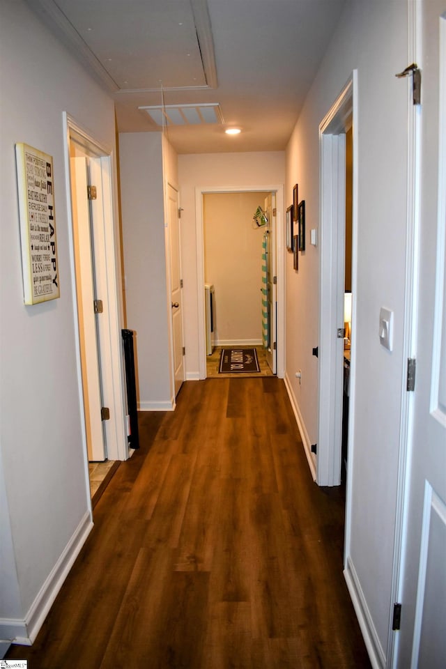 corridor with dark hardwood / wood-style floors