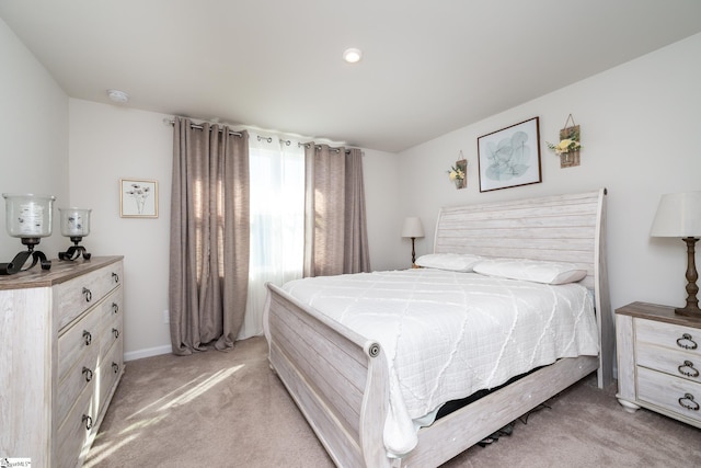 bedroom featuring light colored carpet