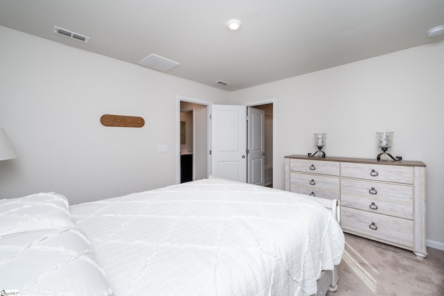 bedroom featuring light colored carpet