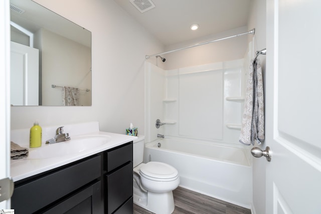 full bathroom featuring shower / bathtub combination, vanity, toilet, and wood-type flooring