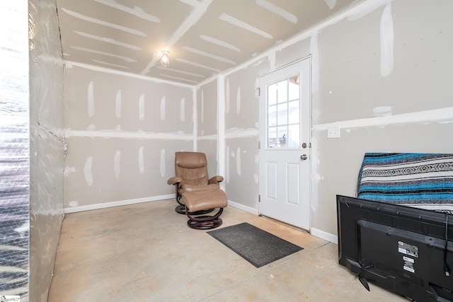 doorway to outside featuring concrete floors