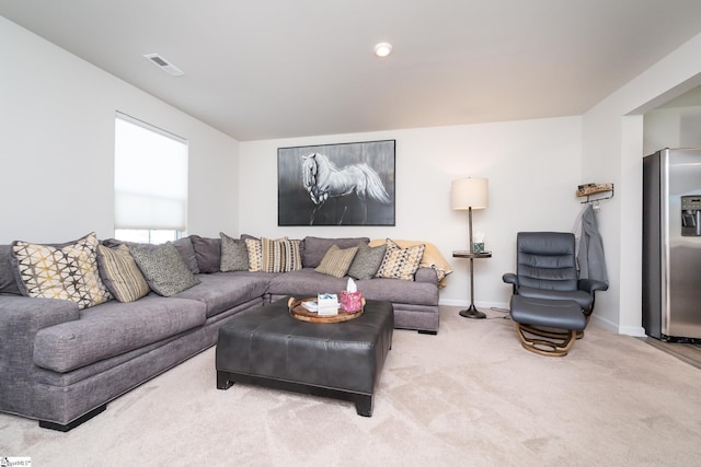 living room with light colored carpet