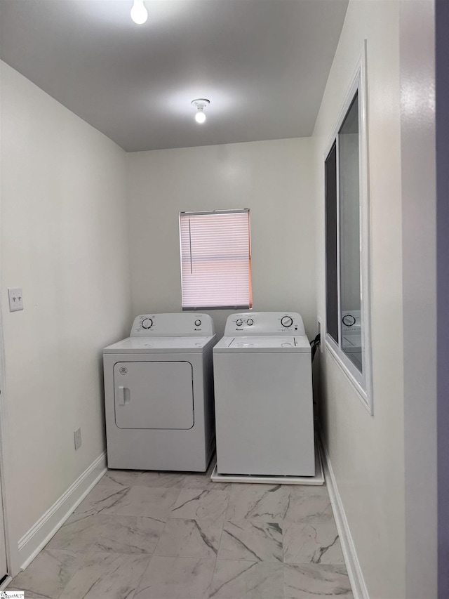 laundry room with washing machine and clothes dryer