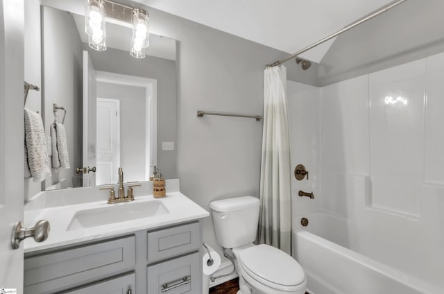 full bathroom featuring toilet, vanity, and shower / tub combo with curtain