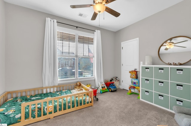 carpeted bedroom featuring ceiling fan