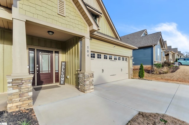 doorway to property featuring a garage