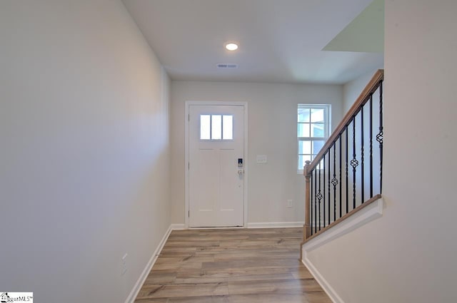 foyer with light wood-type flooring