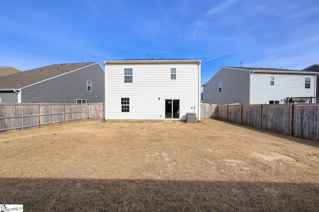 rear view of house featuring central air condition unit