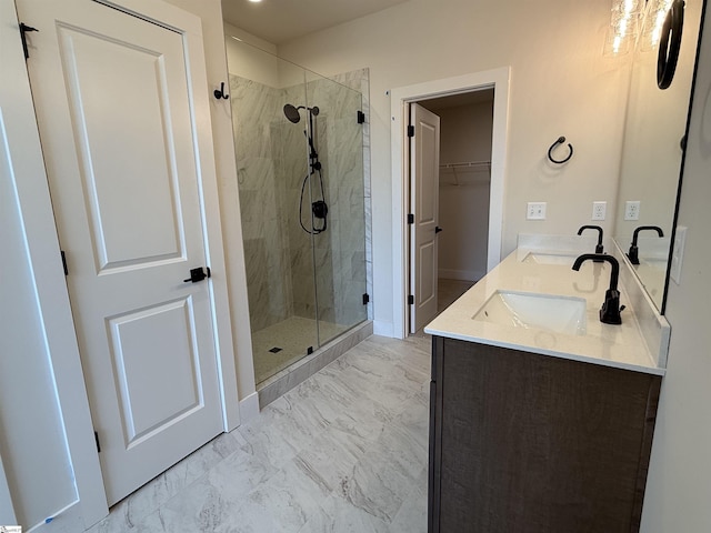 bathroom featuring vanity and a shower with shower door