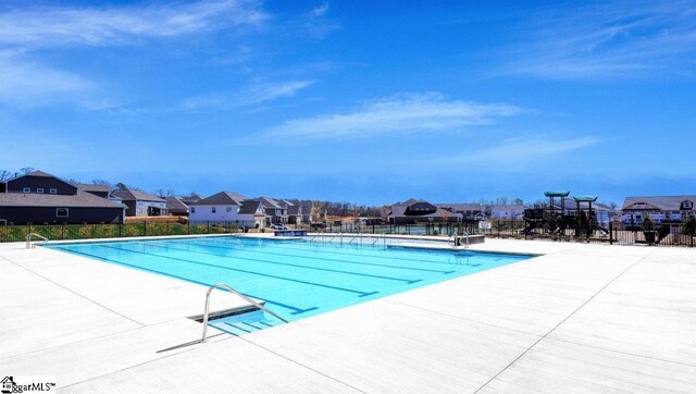 view of swimming pool with a patio