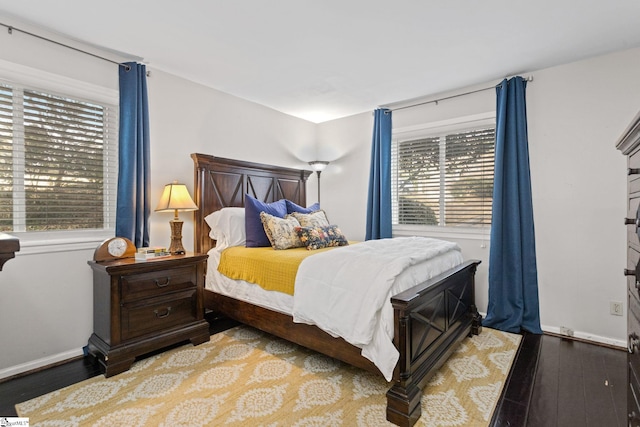 bedroom featuring light hardwood / wood-style floors and multiple windows