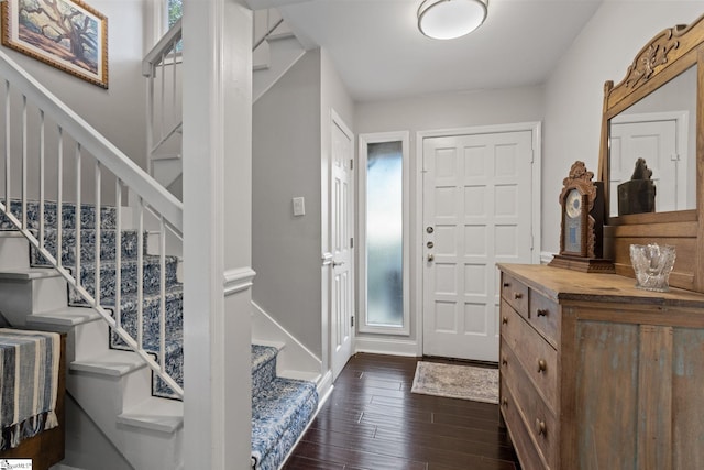 entryway with dark hardwood / wood-style floors