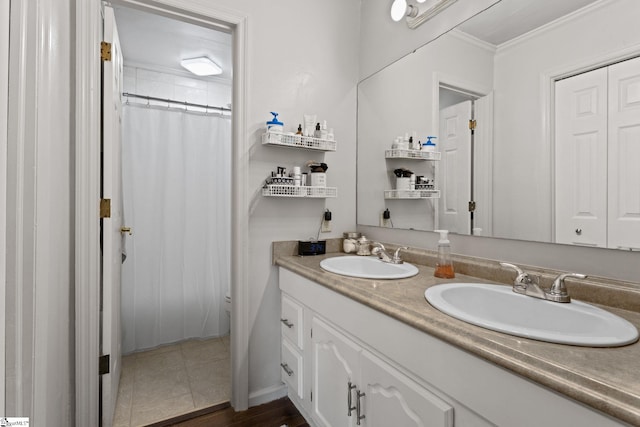 bathroom with tile patterned flooring, vanity, crown molding, and a shower with shower curtain