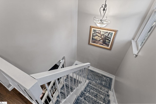 stairway featuring hardwood / wood-style floors