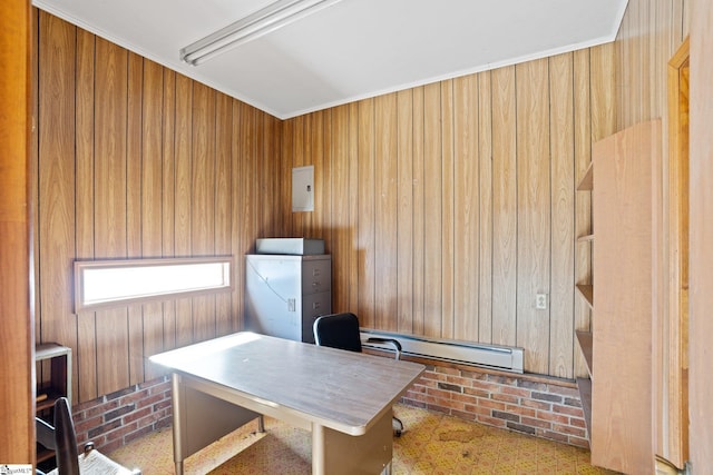 office with baseboard heating, wooden walls, and ornamental molding