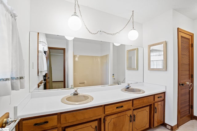 bathroom featuring tile patterned floors and vanity