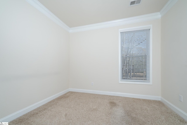 carpeted spare room featuring crown molding