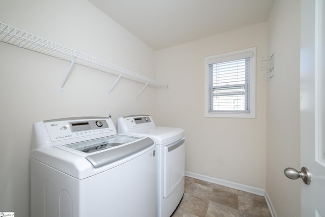 clothes washing area featuring independent washer and dryer