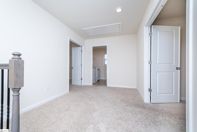 empty room featuring light carpet