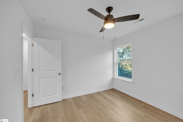 unfurnished room with ceiling fan and light hardwood / wood-style floors