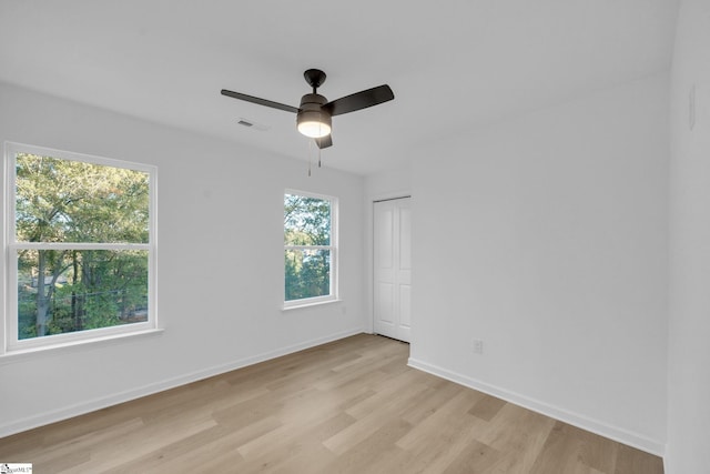 unfurnished room with ceiling fan and light hardwood / wood-style floors