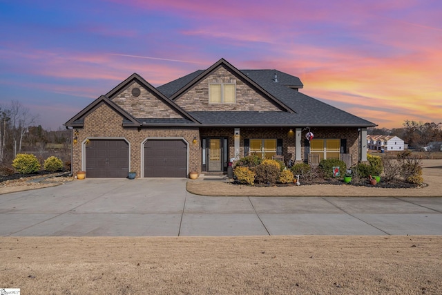 craftsman-style home with covered porch and a garage