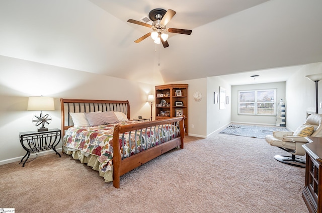 carpeted bedroom featuring vaulted ceiling and ceiling fan