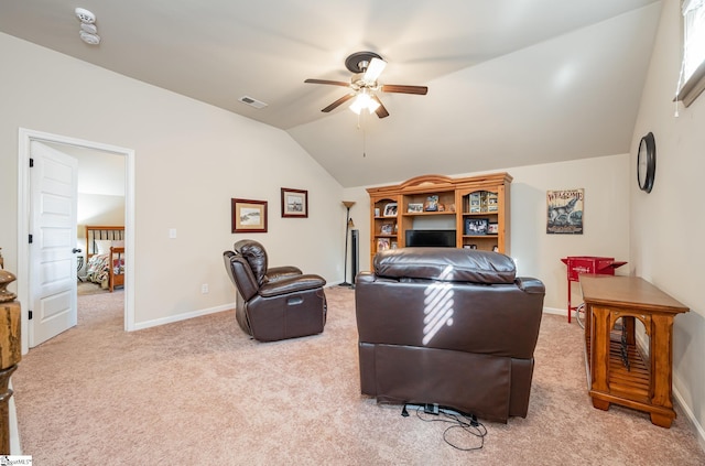 carpeted living room featuring ceiling fan and lofted ceiling