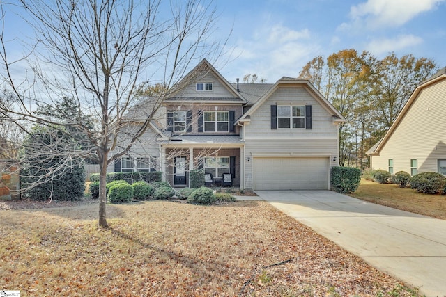 view of front of home with a front yard and a garage