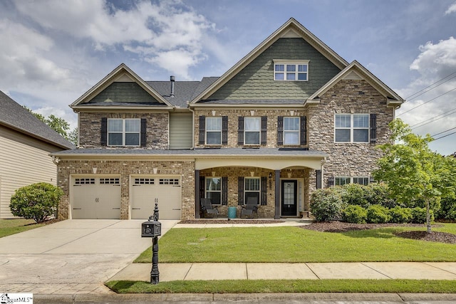 craftsman-style home featuring a porch, a garage, and a front lawn