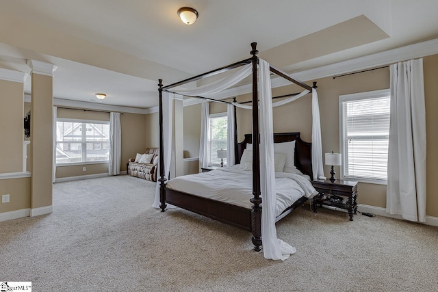 carpeted bedroom featuring multiple windows and crown molding