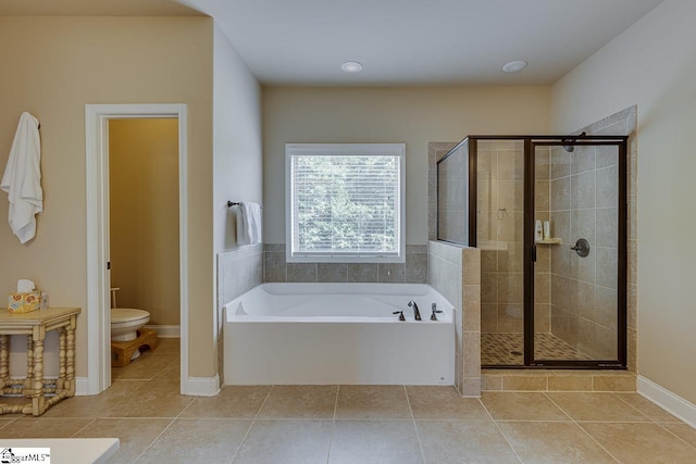 bathroom with tile patterned floors, independent shower and bath, and toilet