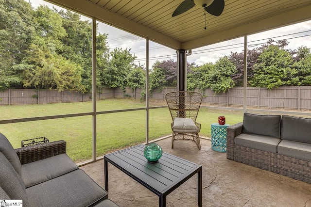 sunroom / solarium with ceiling fan and wood ceiling