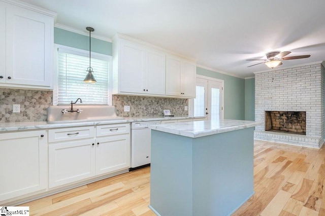 kitchen with dishwasher, light hardwood / wood-style flooring, white cabinetry, and plenty of natural light