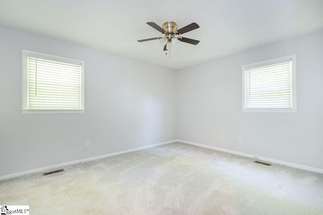 carpeted empty room with ceiling fan